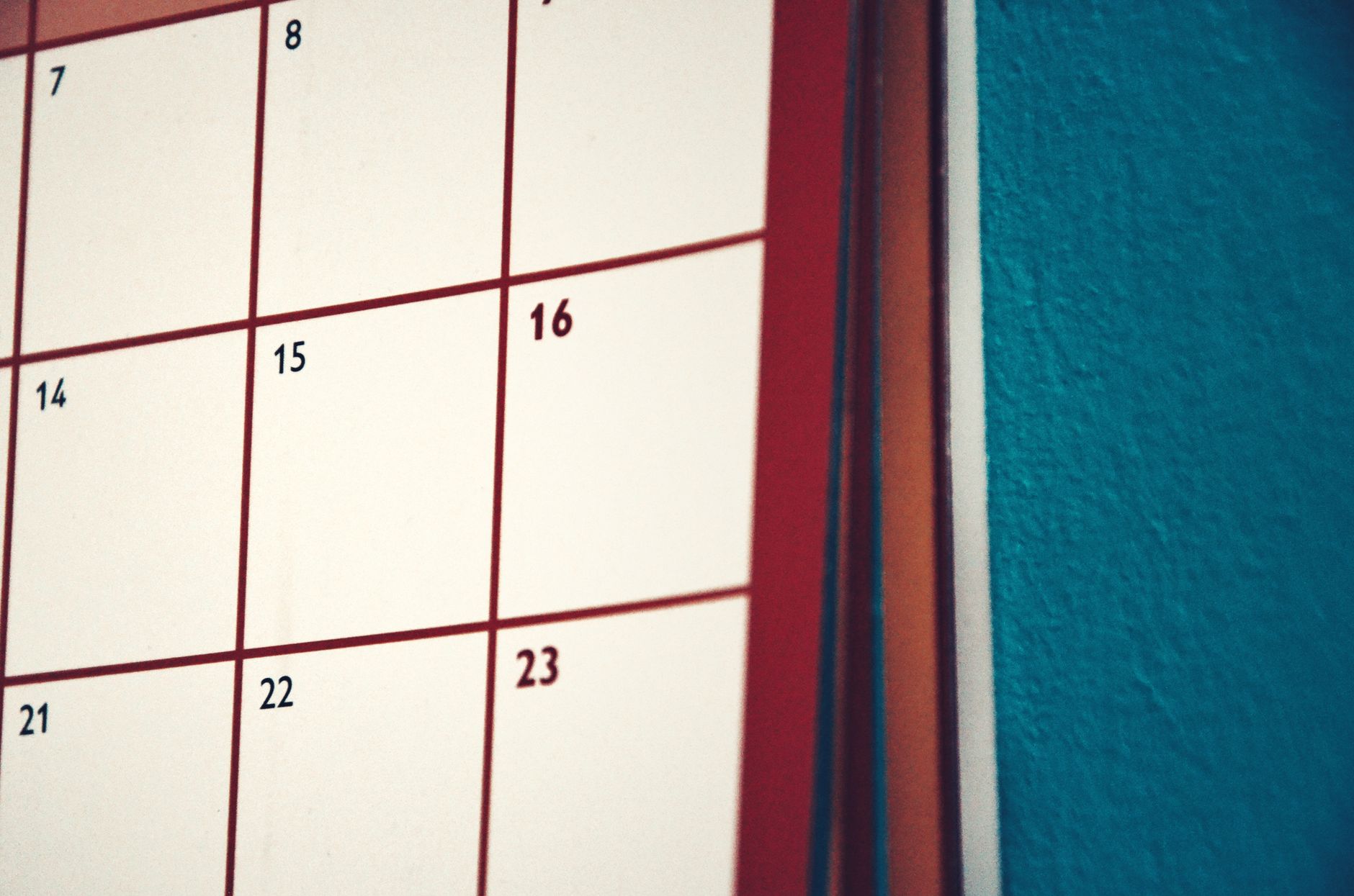 A minimalist calendar hanging on a colorful wall, perfect for planning and organization.